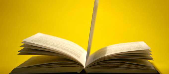 Open book on yellow
