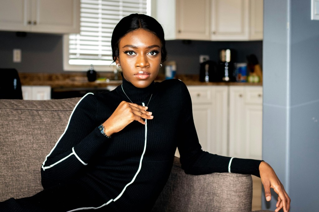 black woman looking thoughtful and cautious